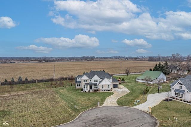 birds eye view of property with a rural view