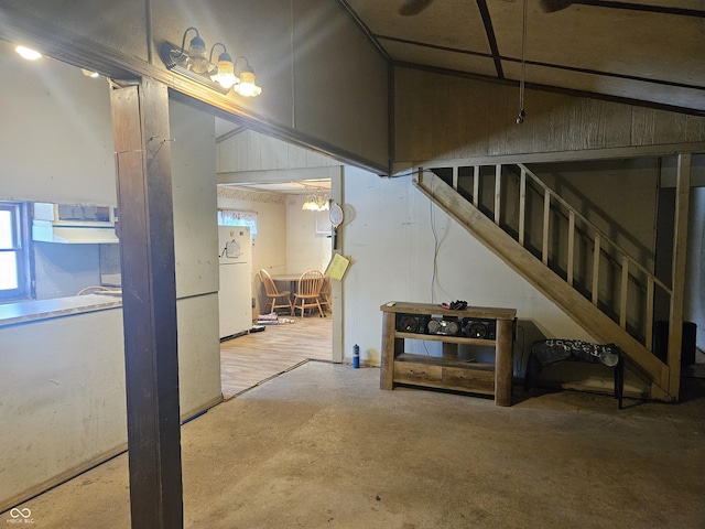 basement featuring white fridge