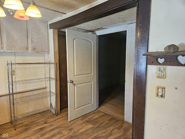 basement featuring dark hardwood / wood-style flooring and a chandelier