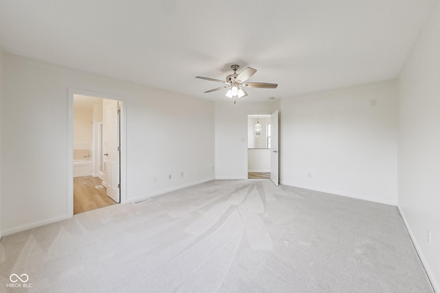 carpeted empty room with ceiling fan