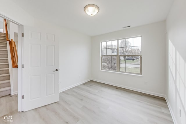 unfurnished room featuring light wood-type flooring