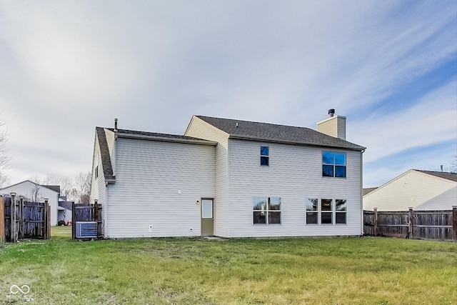 back of property with a yard and cooling unit