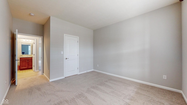 unfurnished bedroom with light carpet