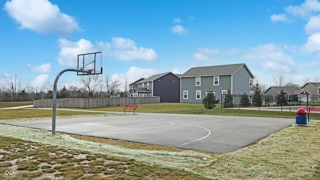 view of basketball court featuring a lawn