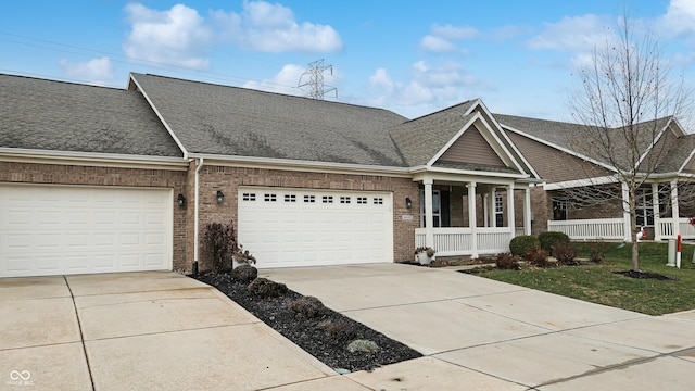 view of front facade with covered porch and a garage