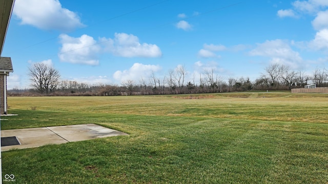 view of yard with a rural view