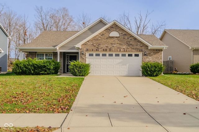 view of front of home featuring a garage and a front lawn