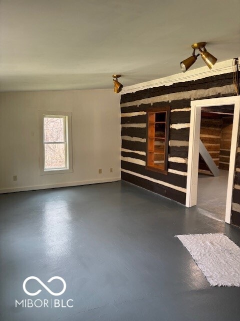 5967 S Lick Creek Rd, Morgantown, IN 46160 - unfurnished living room with finished concrete floors and baseboards