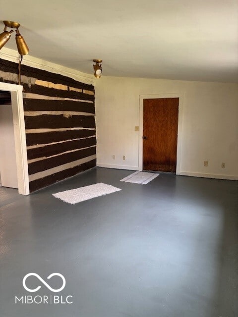 5967 S Lick Creek Rd, Morgantown, IN 46160 - unfurnished living room with finished concrete floors