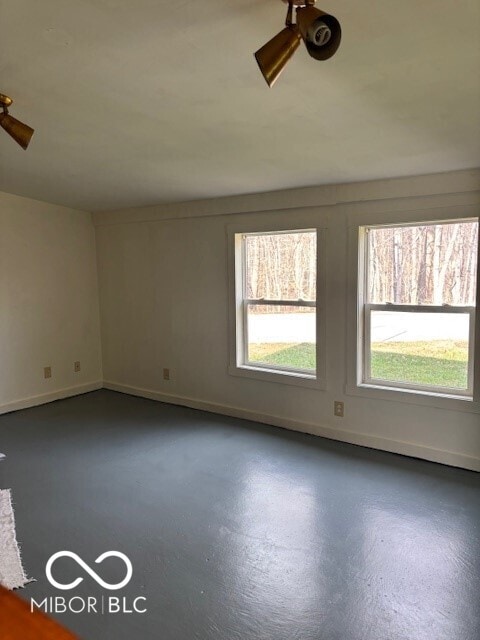 5967 S Lick Creek Rd, Morgantown, IN 46160 - unfurnished room with concrete floors and baseboards