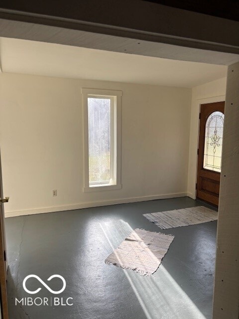 5967 S Lick Creek Rd, Morgantown, IN 46160 - entryway with finished concrete flooring and baseboards