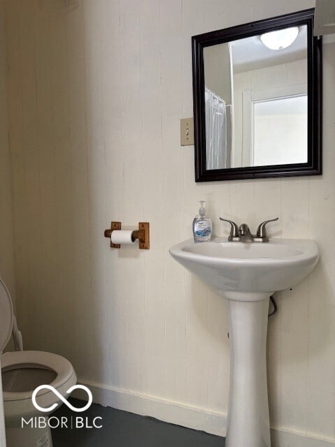 5967 S Lick Creek Rd, Morgantown, IN 46160 - bathroom featuring toilet and baseboards