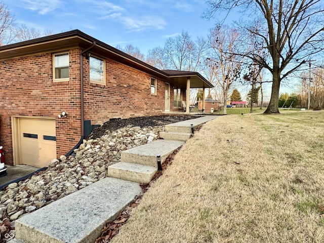 view of property exterior featuring a lawn and a garage