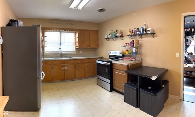 kitchen with sink and appliances with stainless steel finishes