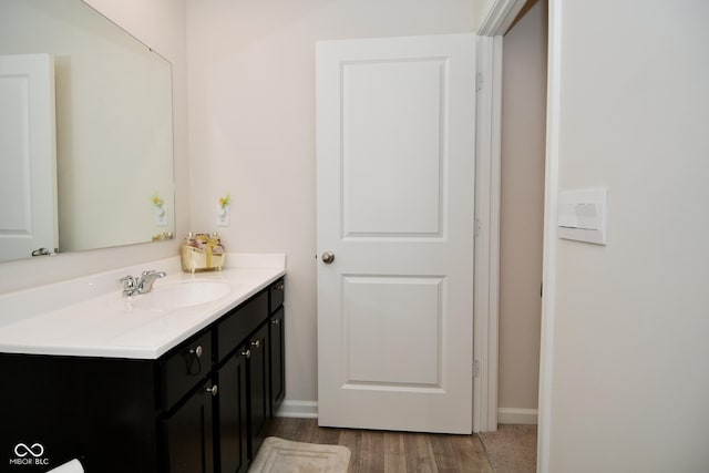 bathroom with vanity and wood-type flooring