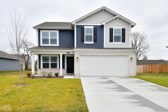 view of front of property with a front lawn and a garage