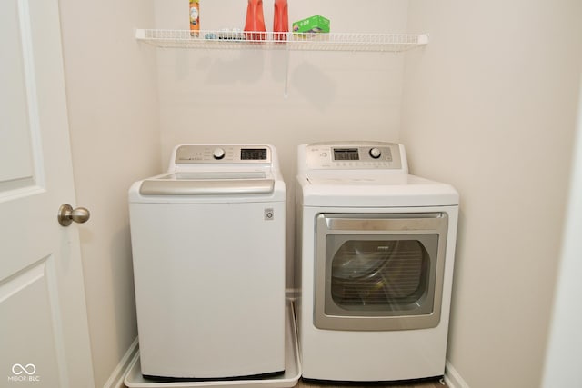 laundry area with washing machine and dryer