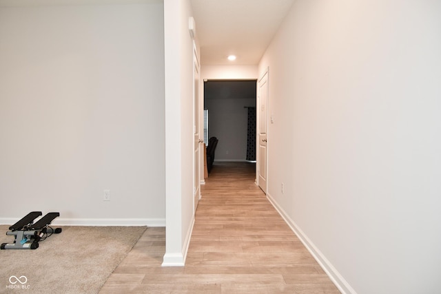 hallway with light wood-type flooring