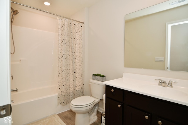 full bathroom with vanity, toilet, and shower / tub combo