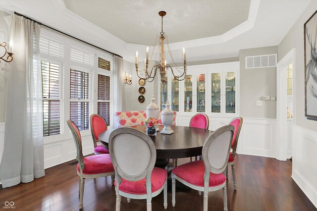 3441 S Overlook Pass, New Palestine, IN 46163 - dining area with a chandelier, a decorative wall, dark wood-style flooring, wainscoting, and a tray ceiling
