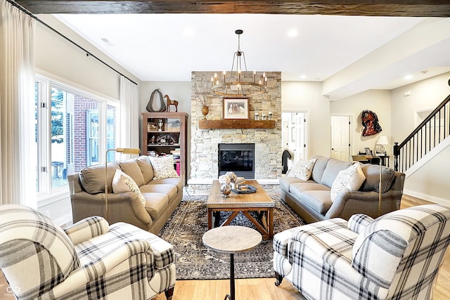 3441 S Overlook Pass, New Palestine, IN 46163 - living area featuring light wood-style flooring, stairway, a chandelier, a fireplace, and recessed lighting