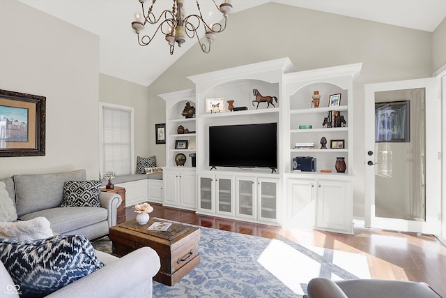 3441 S Overlook Pass, New Palestine, IN 46163 - living area featuring a chandelier, wood finished floors, and high vaulted ceiling