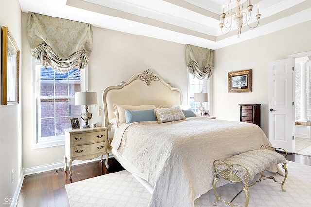 3441 S Overlook Pass, New Palestine, IN 46163 - bedroom with a chandelier, wood finished floors, a tray ceiling, ornamental molding, and connected bathroom