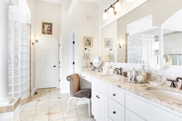 3441 S Overlook Pass, New Palestine, IN 46163 - full bathroom with ornate columns, double vanity, tile patterned floors, a high ceiling, and tiled shower