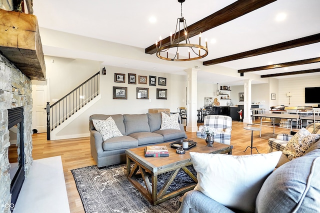 3441 S Overlook Pass, New Palestine, IN 46163 - living area featuring ornate columns, recessed lighting, stairway, light wood finished floors, and a fireplace