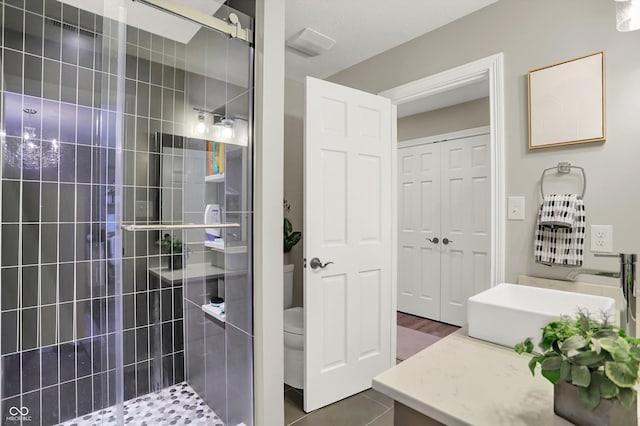 3441 S Overlook Pass, New Palestine, IN 46163 - full bathroom featuring tiled shower, vanity, and tile patterned flooring