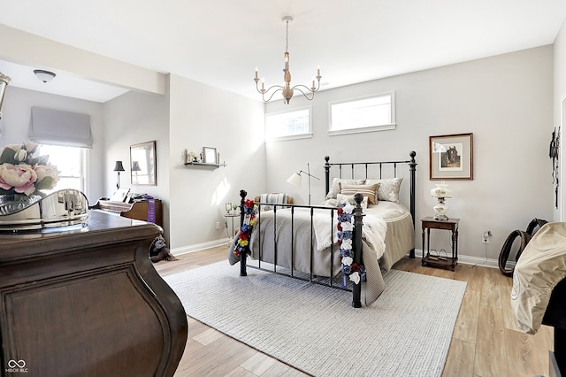 3441 S Overlook Pass, New Palestine, IN 46163 - bedroom featuring a chandelier and light wood finished floors