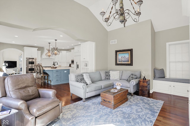 3441 S Overlook Pass, New Palestine, IN 46163 - living room with a chandelier, dark wood-type flooring, arched walkways, high vaulted ceiling, and recessed lighting