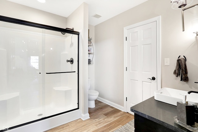 3441 S Overlook Pass, New Palestine, IN 46163 - bathroom with wood finished floors, a stall shower, and vanity