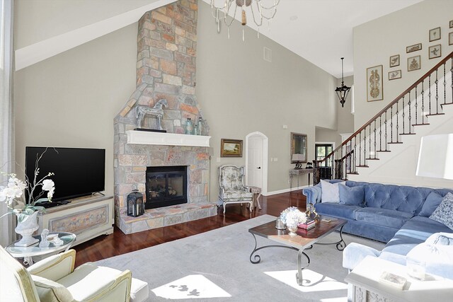 3441 S Overlook Pass, New Palestine, IN 46163 - living area featuring high vaulted ceiling, wood finished floors, stairs, and a fireplace
