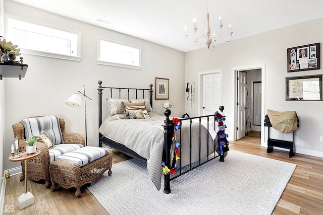 3441 S Overlook Pass, New Palestine, IN 46163 - bedroom with a chandelier and light wood finished floors