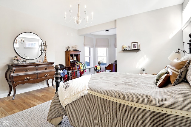 3441 S Overlook Pass, New Palestine, IN 46163 - bedroom with a chandelier and wood finished floors