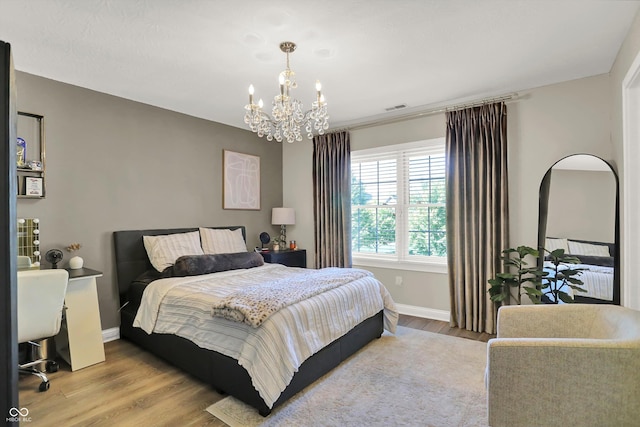 3441 S Overlook Pass, New Palestine, IN 46163 - bedroom with a chandelier and wood finished floors