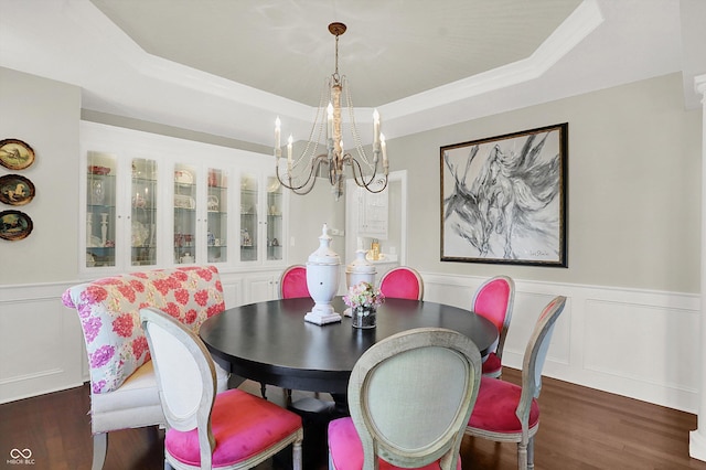 3441 S Overlook Pass, New Palestine, IN 46163 - dining space with a chandelier, wood finished floors, a tray ceiling, a wainscoted wall, and a decorative wall