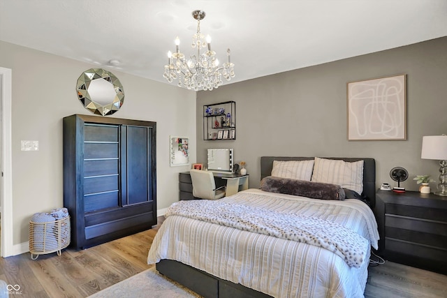 3441 S Overlook Pass, New Palestine, IN 46163 - bedroom with a chandelier and wood finished floors