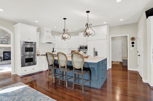 3441 S Overlook Pass, New Palestine, IN 46163 - kitchen with appliances with stainless steel finishes, white cabinetry, tasteful backsplash, custom exhaust hood, and recessed lighting