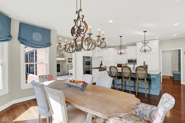 3441 S Overlook Pass, New Palestine, IN 46163 - dining room with a chandelier, dark wood-style flooring, recessed lighting, and a fireplace