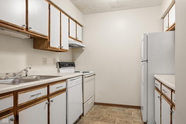 kitchen featuring a textured ceiling, sink, white cabinets, and white appliances