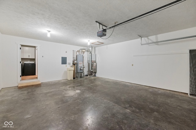 garage with electric panel, a garage door opener, gas water heater, and washing machine and dryer