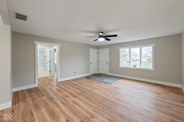 spare room featuring light hardwood / wood-style floors and ceiling fan