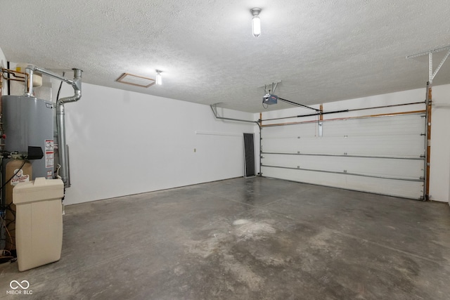 garage featuring a garage door opener and water heater