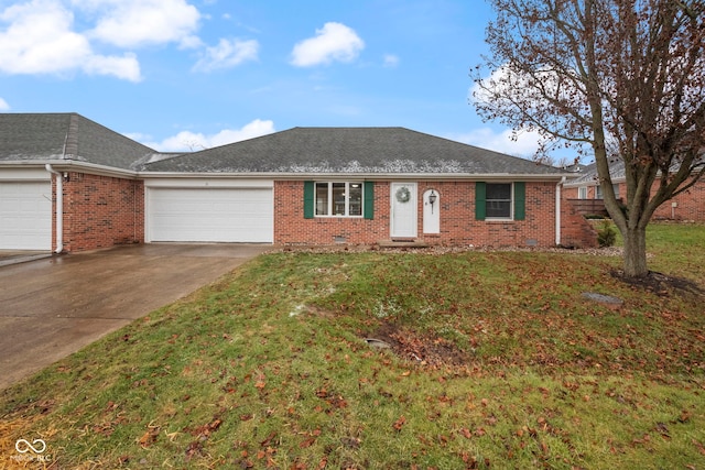 ranch-style house featuring a garage and a front lawn