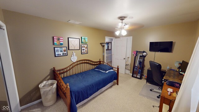 bedroom with ceiling fan and carpet floors