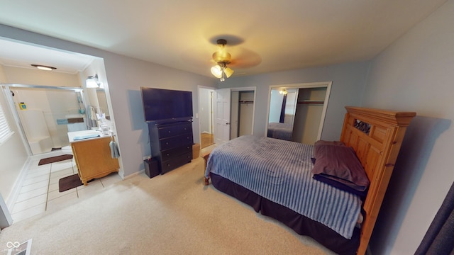 bedroom with ceiling fan and light colored carpet