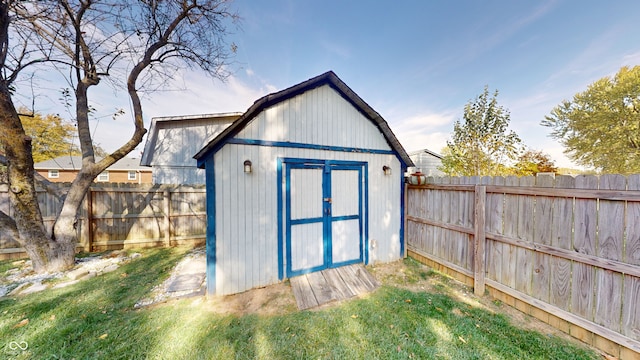 view of outbuilding featuring a yard