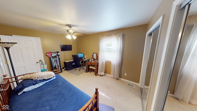 carpeted bedroom featuring ceiling fan